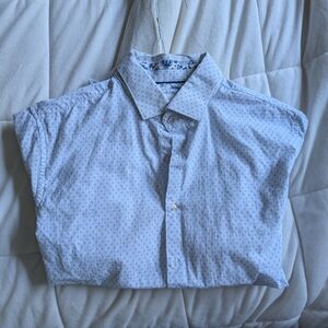 button down light blue with blue dot pattern. medium